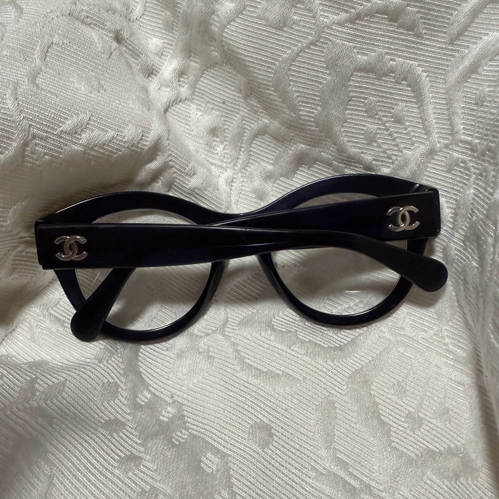 CHANEL Black Round Glasses with Silver Accents